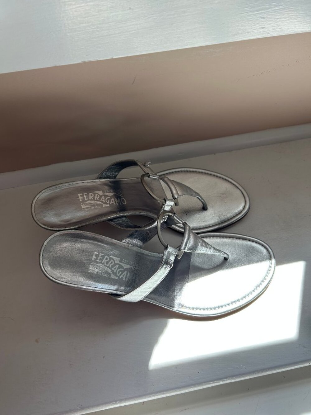Salvatore Ferragamo silver metallic thong sandals, size 9AA